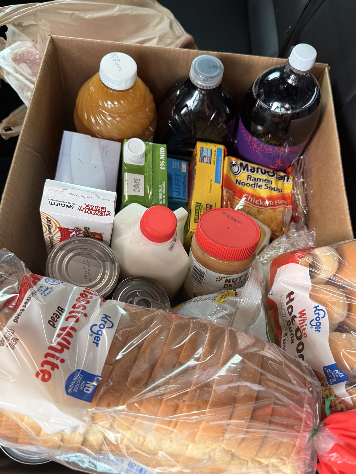 A food box with bread and pantry items
